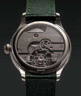 View over the case back of the Série Atelier VII classic tourbillon teal with for the very first time for LF, rhodium wheels and barrel