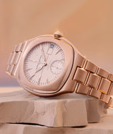Lifestyle picture of the Sport Auto 79 watch in red gold with a rose-silver opaline dial.