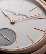 Dial focus on the Square Micro-Rotor Silver watch with a vertcial satin brushed dial and red gold Assegai hands and drop-shaped indices.