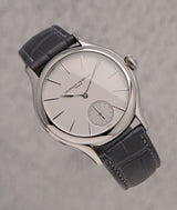classic micro-rotor laurent ferrier watch in white-gold with satin brushed silver dial and dark grey anthracite crocodile bracelet and grey background