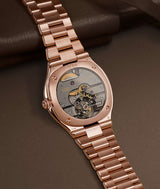 Movement view of model 1/24 of the Tourbillon Grand Sport 'Golden Brown' resting on a brown background and brown leather case, features the beautiful LF 169.01 tourbillon caliber. Shot by Cyril Biselx