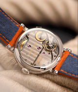 Running 126.01 movement of exclusive online limited ecole annual calendar navy and orange bracelet by Laurent Ferrier, Geneva, Switzerland