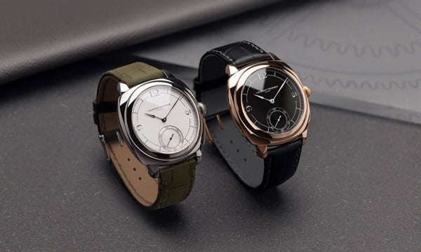 Two cushion shaped watches by Laurent Ferrier. A white dial one with stainless steel case and green bracelet and a 18k red gold case one featuring a black dial with white inscriptions and a black crocodile bracelet. Photographer Cyril Biselx