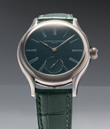 Classic Tourbillon Teal lifestyle picture with its teal grand feu enamel dial and green leather strap lit from above