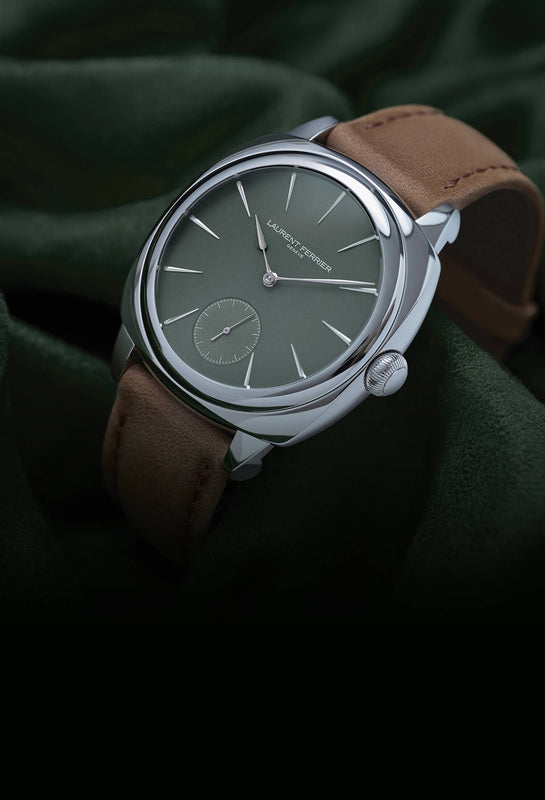 Lifestyle shot of LAURENT FERRIER's Evergreen dial watch with Micro-Rotor in Square stainless steel case and brown leather strap on wrinkly green suede fabric