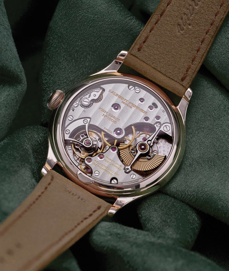 Back lifestyle shot of the Classic 'Evergreen' by Swiss fine watch maker Laurent Ferrier. The highly hand finished micro-rotor movement is visible through the sapphire case back.