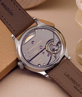 back movement view of laurent ferrier "LF 116.01" origin movement with brown bracelet. Shot by Cyril Biselx