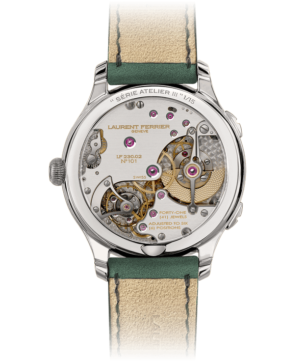 Back with view of LF230.02 dual-time Traveller movement through sapphire glass caseback. The movement of the Série Atelier III has an exclusive brushed rhodium finish. 