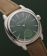 LAURENT FERRIER fine watch 'Evergreen' model in its 'Square' stainless steel case version on a green background.